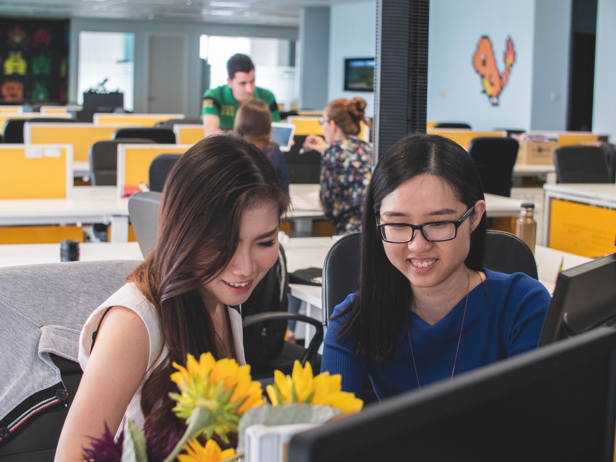Happy worker in the office using Happily.ai
